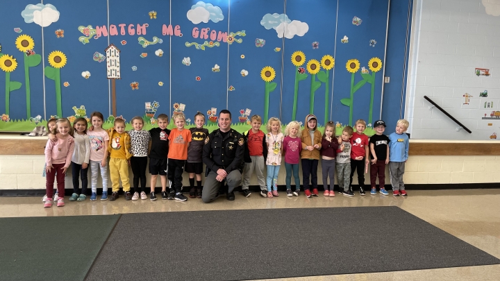 preschool students standing in front of the stage